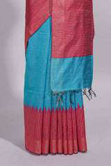 Aqua blue Tussar saree with magenta zari woven border and contrast pallu with matching magenta blouse