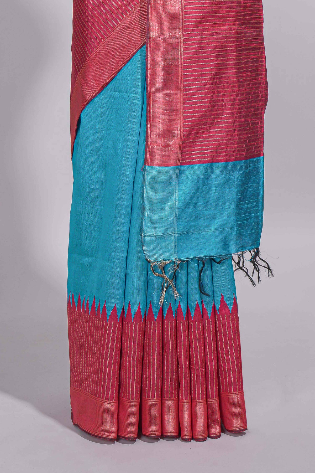 Aqua blue Tussar saree with magenta zari woven border and contrast pallu with matching magenta blouse