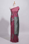Dark maroon color tussar saree with subtle silver woven motifs paired with a rich zari pallu with tassels with contrast blouse piece