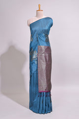 Borderless floral design blue art tussar saree with contrast pallu and silver motifs blouse