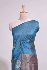 Borderless floral design blue art tussar saree with contrast pallu and silver motifs blouse