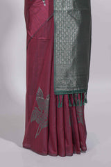 Dark maroon color tussar saree with subtle silver woven motifs paired with a rich zari pallu with tassels with contrast blouse piece