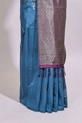 Borderless floral design blue art tussar saree with contrast pallu and silver motifs blouse