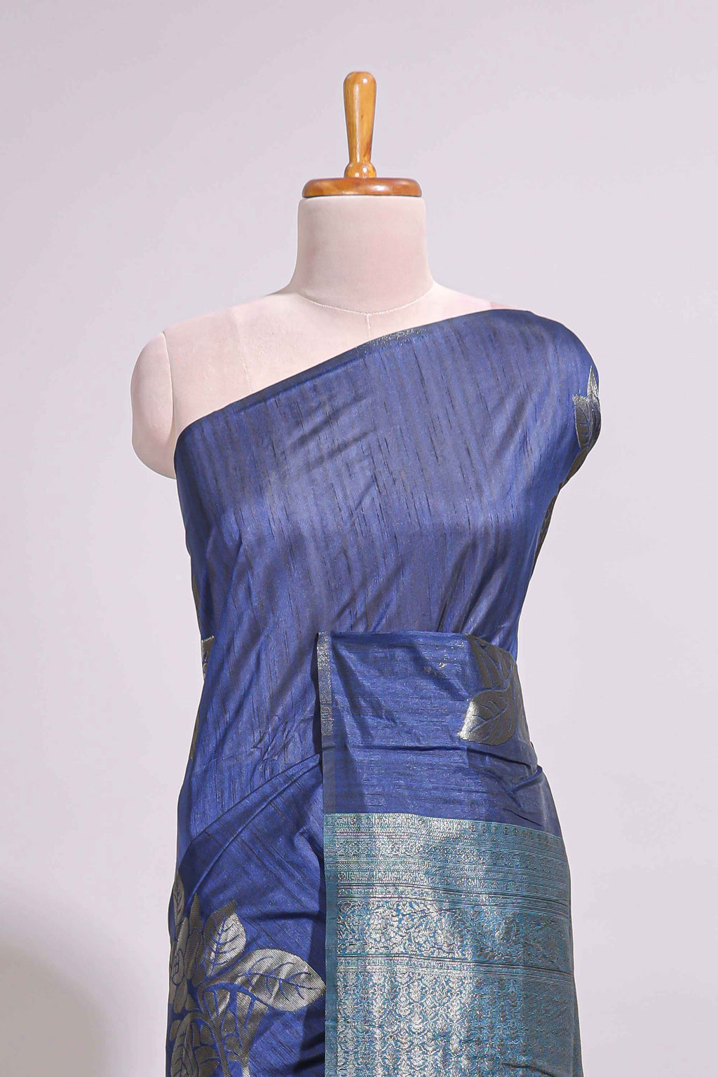 Borderless floral design blue art tussar saree with contrast pallu and silver motifs blouse