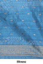 Borderless floral design blue art tussar saree with contrast pallu and silver motifs blouse