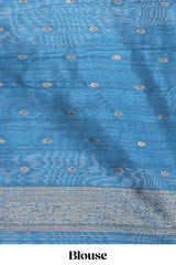 Borderless floral design blue art tussar saree with contrast pallu and silver motifs blouse