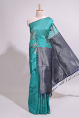 Borderless floral design green art tussar saree with contrast pallu and silver motifs blouse