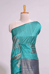 Borderless floral design green art tussar saree with contrast pallu and silver motifs blouse