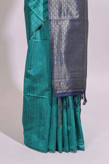 Borderless floral design green art tussar saree with contrast pallu and silver motifs blouse