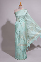 Green zari floral design art tusser saree with self zari border and matching floral motits blouse