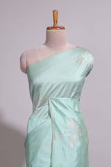 Green zari floral design art tusser saree with self zari border and matching floral motits blouse