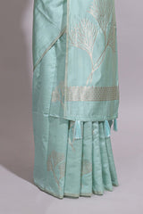 Green zari floral design art tusser saree with self zari border and matching floral motits blouse