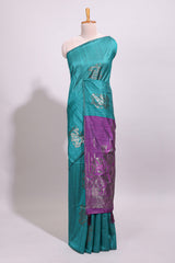Borderless green textured zari motifs art tussar saree with contrast floral design pallu and zari motifs blouse