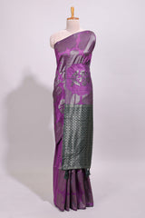 Borderless purple floral zari design art tussar saree with self floral design pallu and matching zari motifs blouse