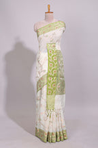White floral design art tussar saree with contrast border and floral vine pallu