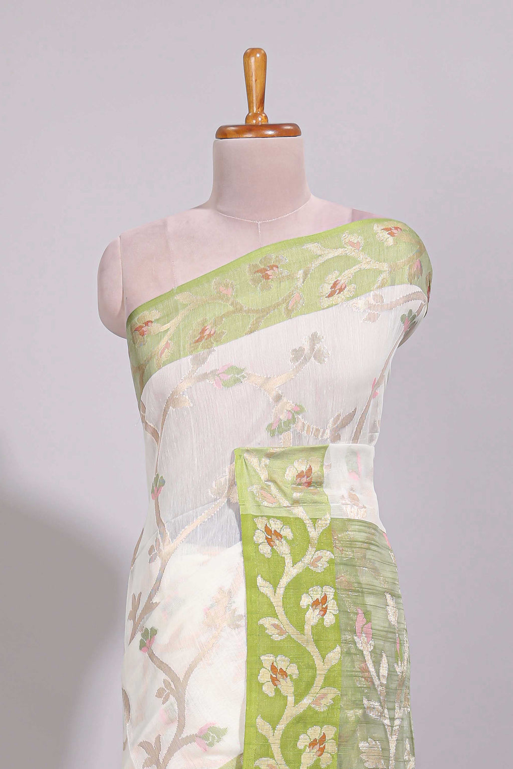 White floral design art tussar saree with contrast border and floral vine pallu