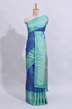 Blue geometric zari butta art tussar saree with contrast zari border and striped blouse