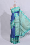 Blue geometric zari butta art tussar saree with contrast zari border and striped blouse