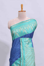 Blue geometric zari butta art tussar saree with contrast zari border and striped blouse