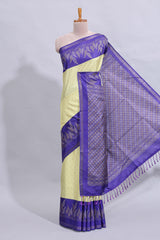 Pale yellow geometric zari butta art tussar saree with contrast zari border and striped blouse