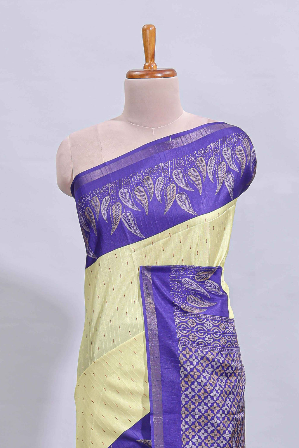 Pale yellow geometric zari butta art tussar saree with contrast zari border and striped blouse