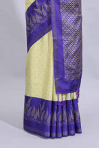 Pale yellow geometric zari butta art tussar saree with contrast zari border and striped blouse