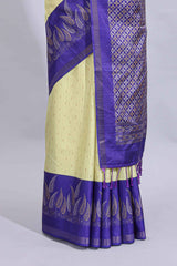 Pale yellow geometric zari butta art tussar saree with contrast zari border and striped blouse