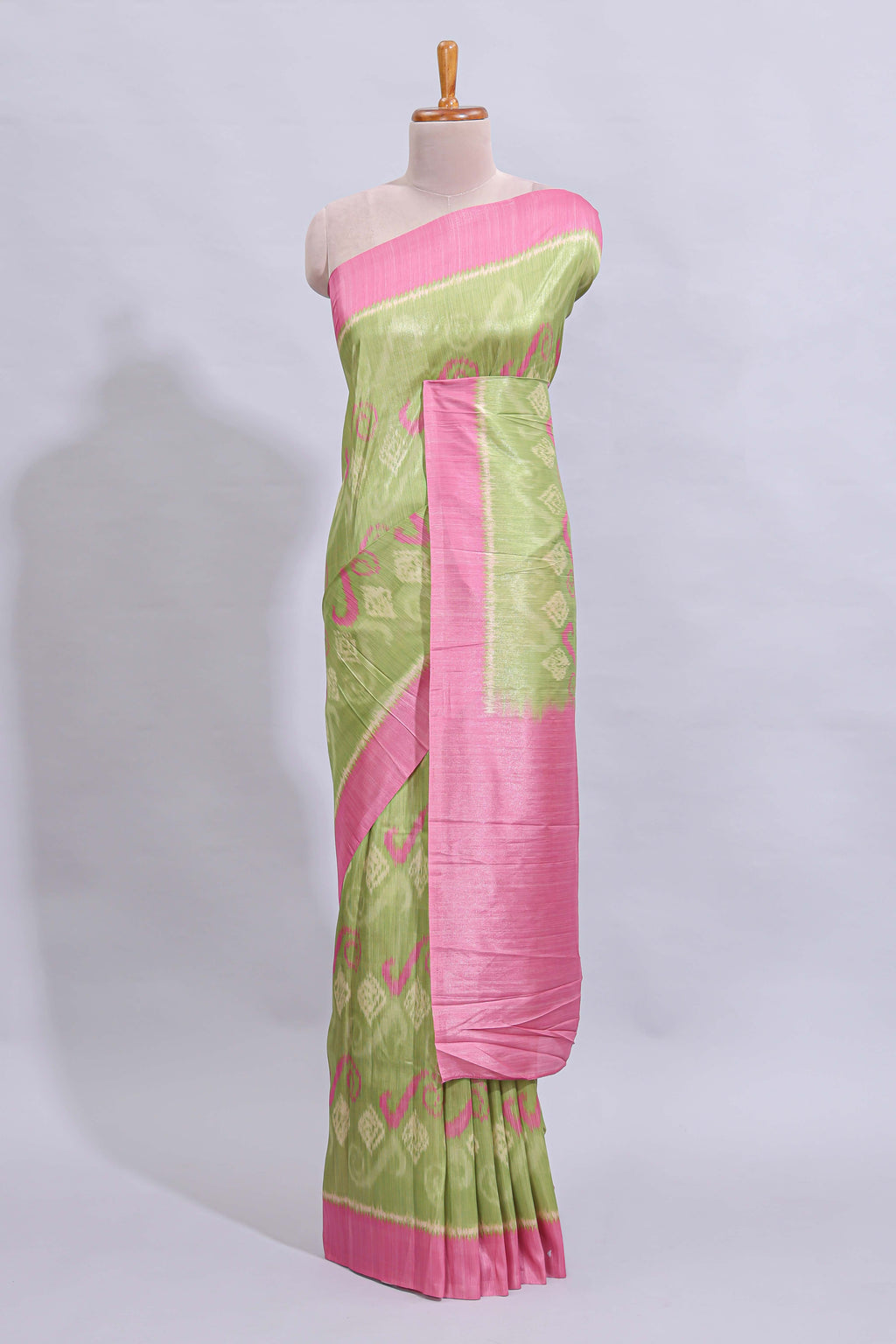 Green geometric design butta art tussar saree with contrast border and plain blouse