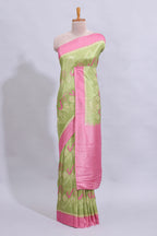 Green geometric design butta art tussar saree with contrast border and plain blouse