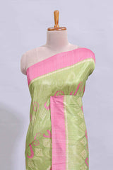 Green geometric design butta art tussar saree with contrast border and plain blouse