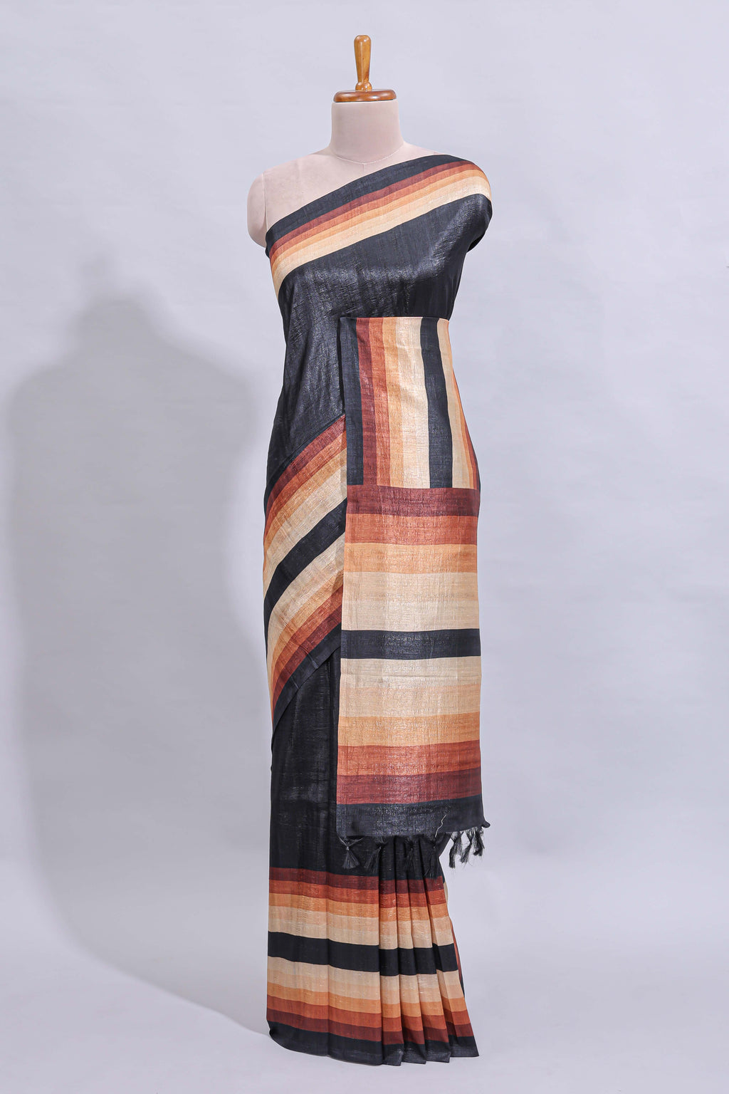 Black textured plain art tussar saree with contrast border and matching striped blouse