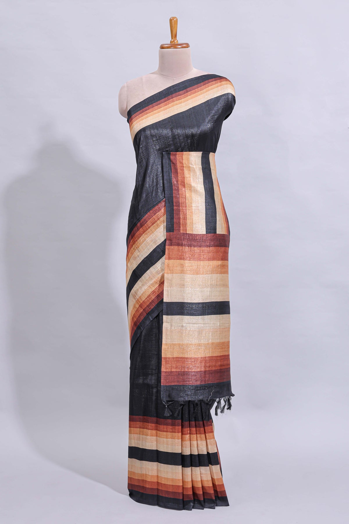 Black textured plain art tussar saree with contrast border and matching striped blouse