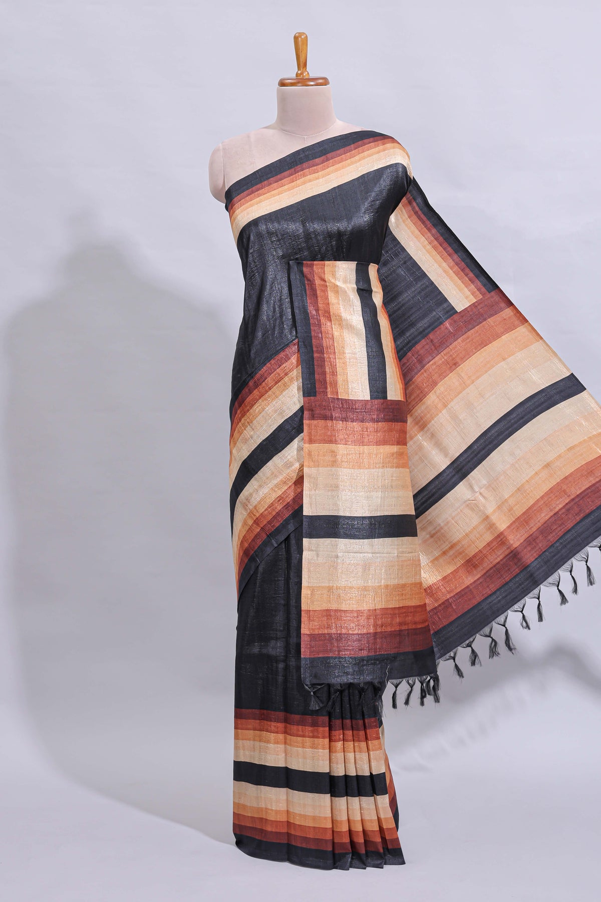 Black textured plain art tussar saree with contrast border and matching striped blouse