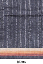 Black textured plain art tussar saree with contrast border and matching striped blouse