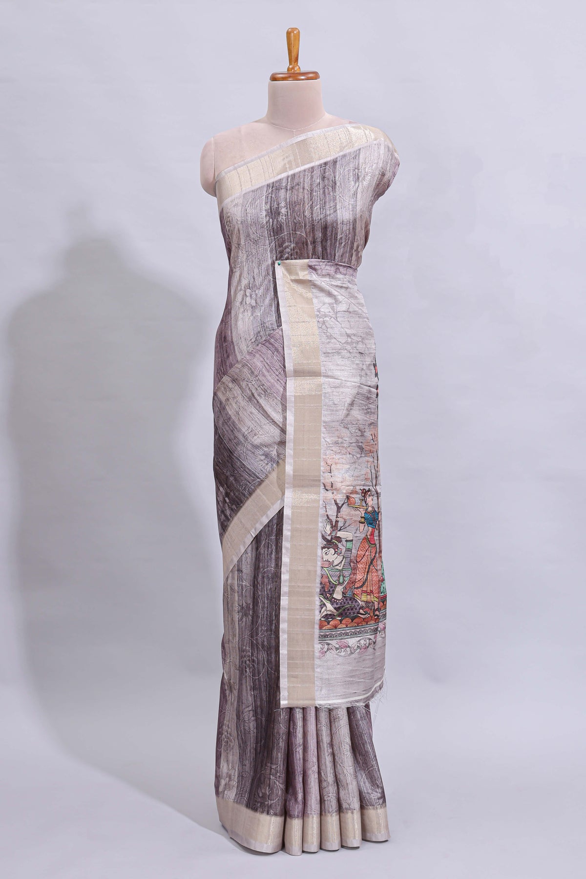 Grey kalamkari style floral design art tussar saree with contrast border and matching striped blouse