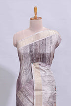 Grey kalamkari style floral design art tussar saree with contrast border and matching striped blouse