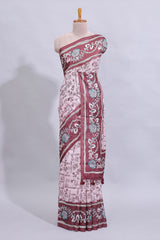 Pale pink floral design art tussar saree with contrast border and matching motifs blouse