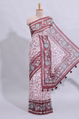 Pale pink floral design art tussar saree with contrast border and matching motifs blouse