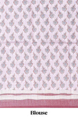 Pale pink floral design art tussar saree with contrast border and matching motifs blouse
