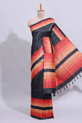 Black textured plain art tussar saree with contrast orange border and matching striped blouse