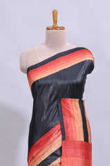 Black textured plain art tussar saree with contrast orange border and matching striped blouse