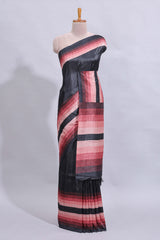 Black textured plain art tussar saree with contrast pink border and matching striped blouse