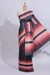Black textured plain art tussar saree with contrast pink border and matching striped blouse