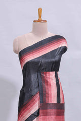 Black textured plain art tussar saree with contrast pink border and matching striped blouse