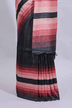 Black textured plain art tussar saree with contrast pink border and matching striped blouse