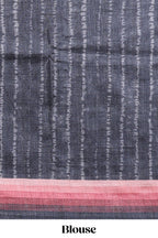 Black textured plain art tussar saree with contrast pink border and matching striped blouse