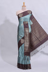 Powder blue floral motifs art tussar saree with contrast zari border and plain blouse