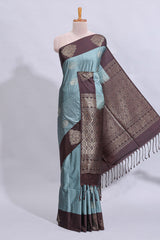 Powder blue floral motifs art tussar saree with contrast zari border and plain blouse