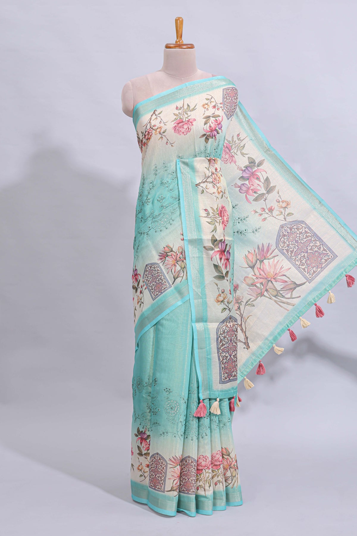 Blue floral design art tussar saree with self zari border and matching printed blouse