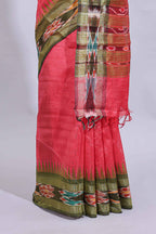 Pink plain art tussar saree with contrast ikkat style border and floral design striped pallu
